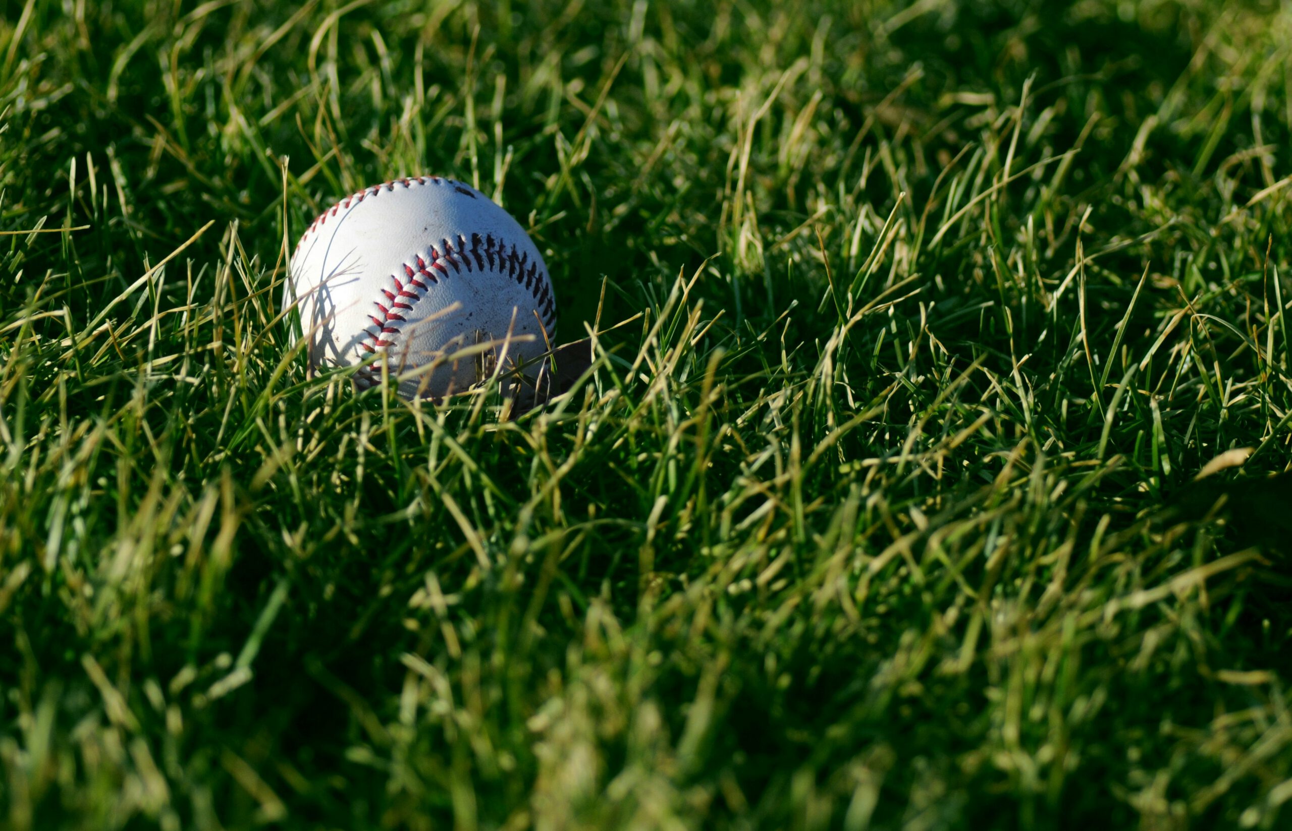 uplcose baseball in a grass-field